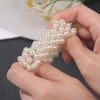The new pearl hair band exudes a light luxury and trendy Korean style. It features a small flower-shaped female ponytail band headwear and a leather band hair tie Application Scenario